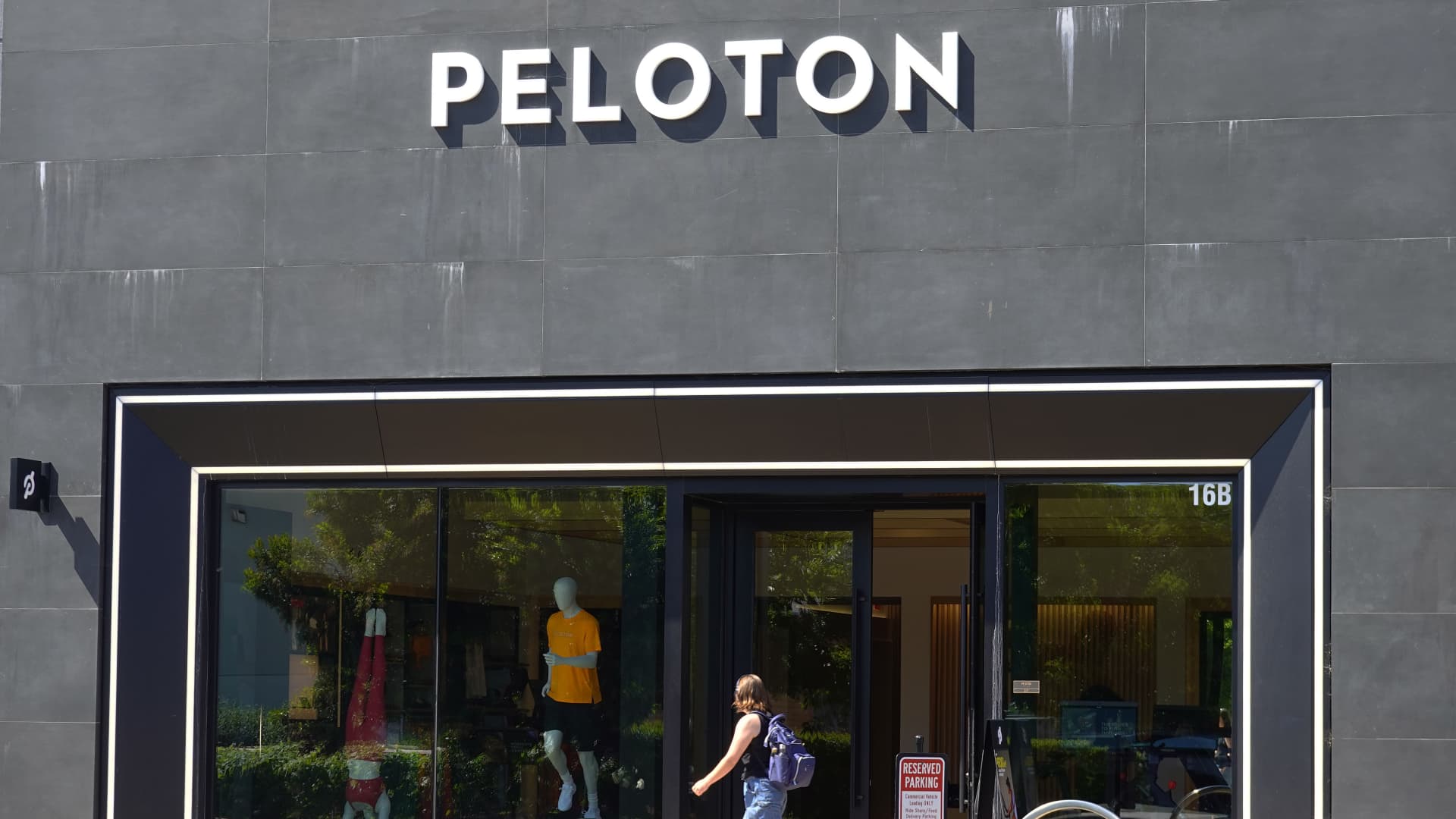 Peloton posts first ever annual net profit, but shares drop as outlook disappoints