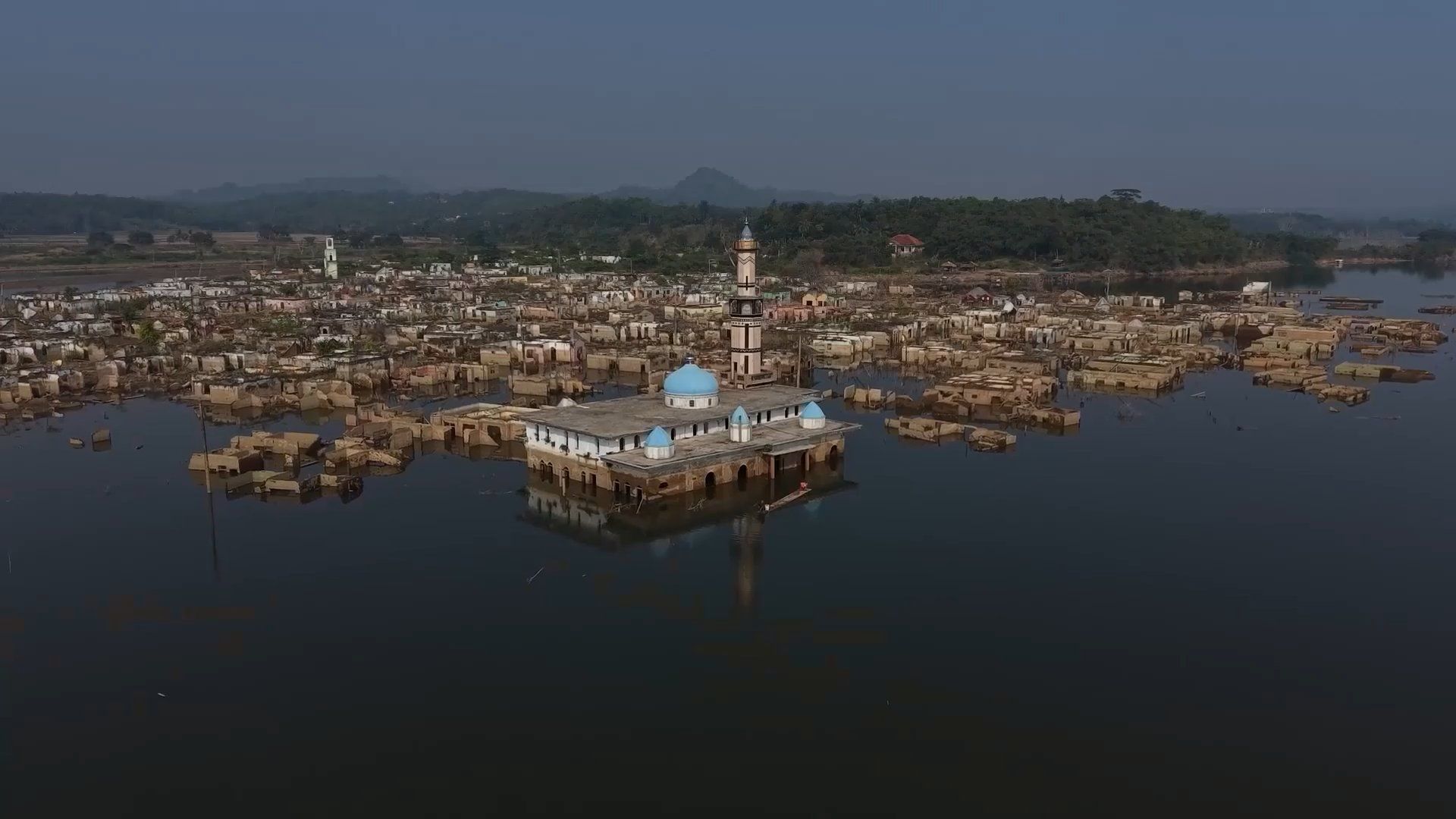 Submerged Indonesian village re-emerges as drought lowers water levels