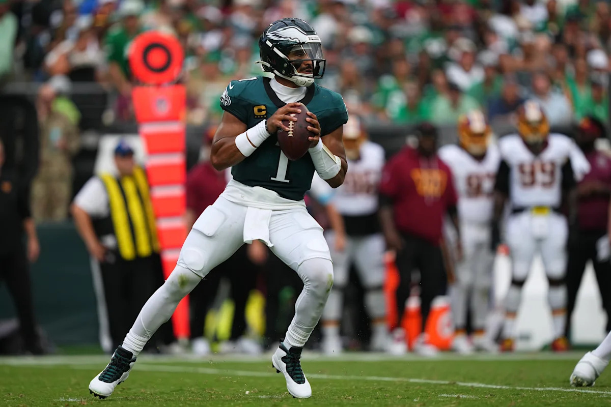 Jalen Hurts throws 3 TD passes and Eagles stuff Commanders' late 2-point try for 24-22 win